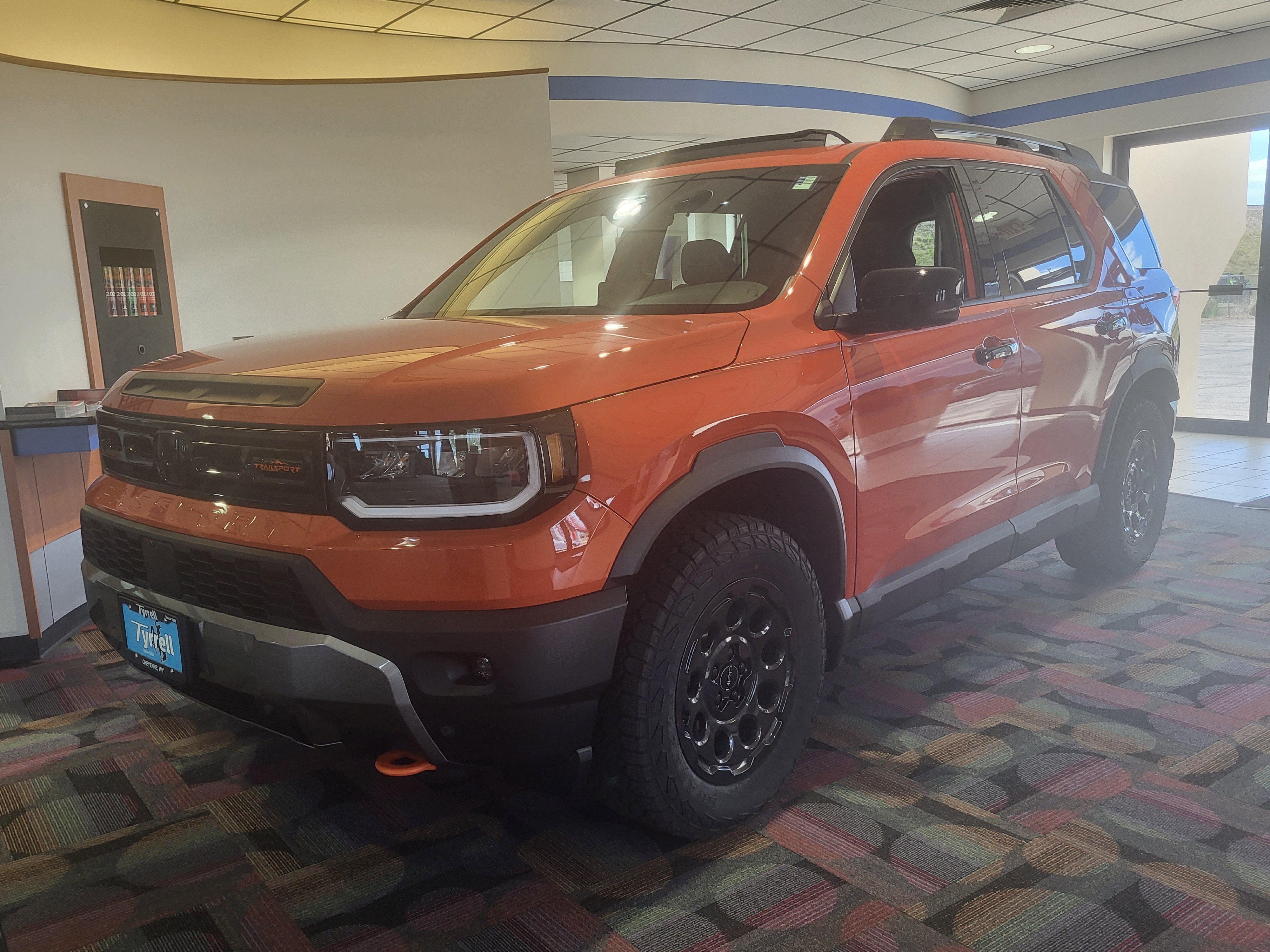 2026 Honda Passport TrailSport Elite in Sunset Orange — front three-quarter view